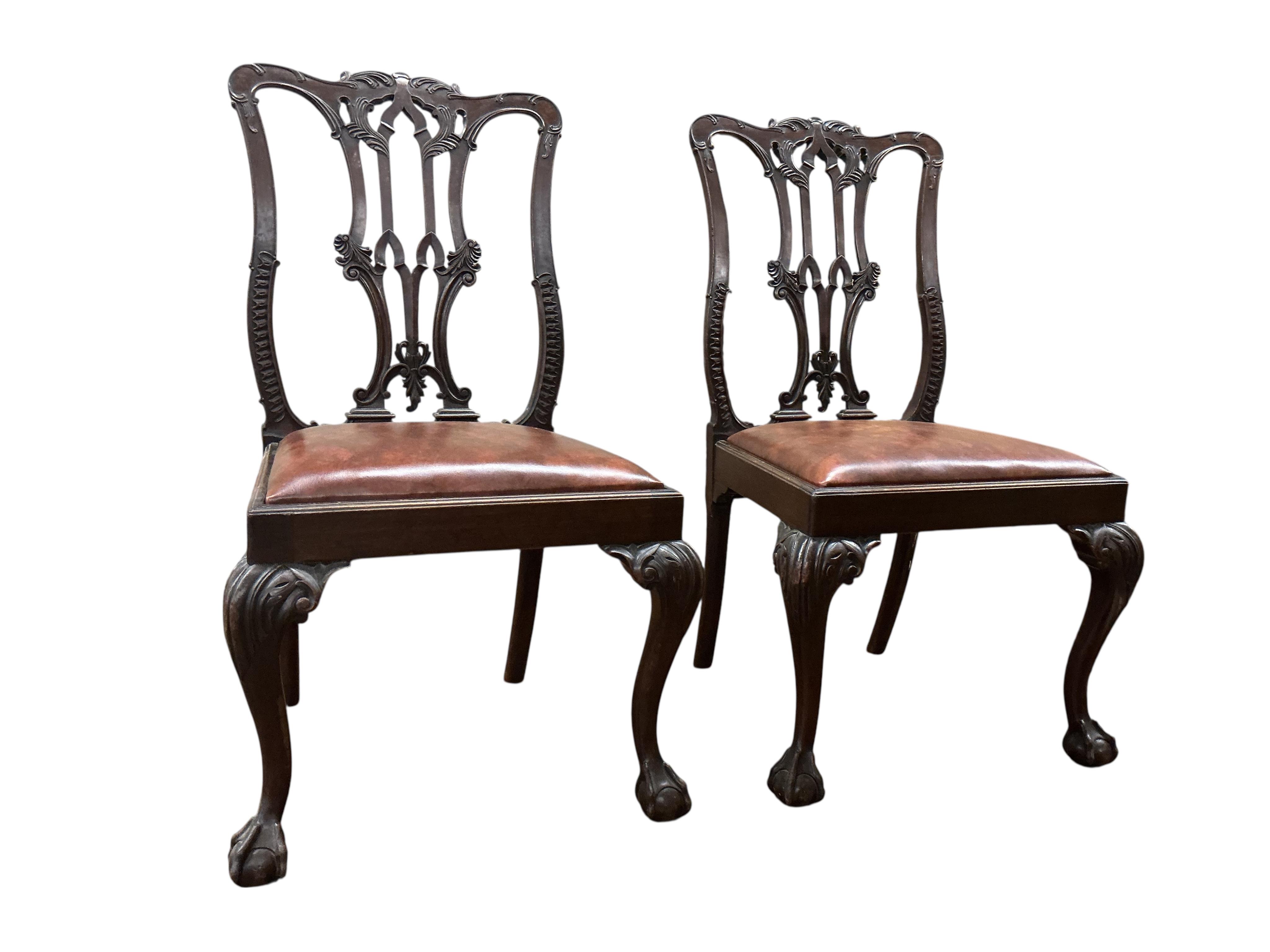 A set of six Chippendale Revival mahogany dining chairs, two with arms